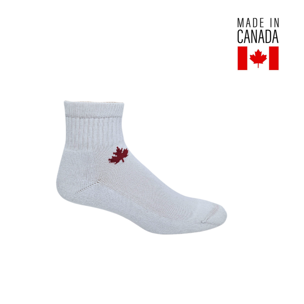 A pair of white 1/4 length bamboo athletic socks with a red Canadian maple leaf design on the side, marked with 'Made in Canada' text.