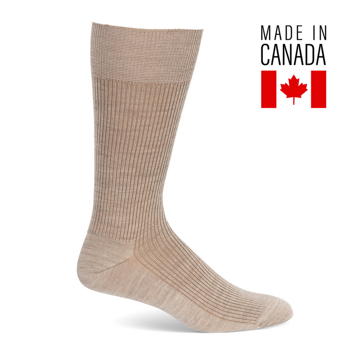 A pair of beige men's merino wool ribbed dress socks with the text 'Made in Canada' and a Canadian flag symbol.